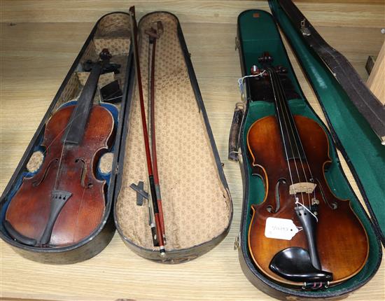 A German Strad style violin and a small violin and two bows